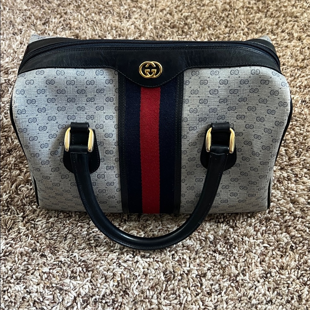 Gucci Vintage “Boston” monogram bag in navy with red stripe.